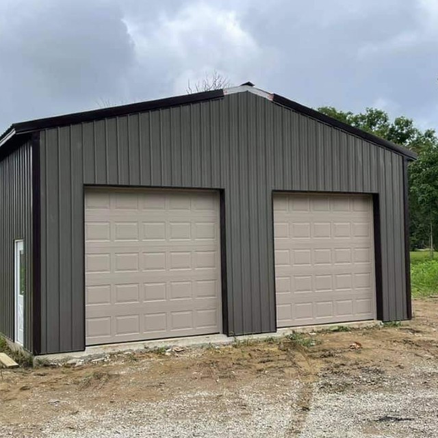 tan garage doors on gray metal building