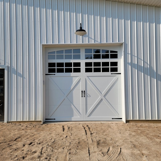 New white garage door on metal building